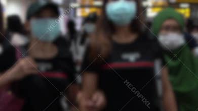 Slow motion blurred defocused view of people wearing the mask as coronavirus