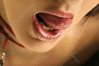 Woman licking lips.