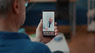 Senior person meeting on online videocall with doctor