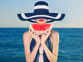 Young lady at sea with watermelon
