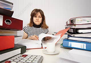Female accountant very busy in office