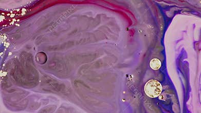 Close-up light purple oil paints are mixed together like artwork brought to life