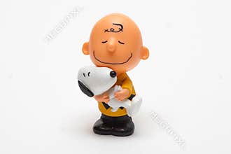 Children`s toy Boy with Snoopy dog on a white background