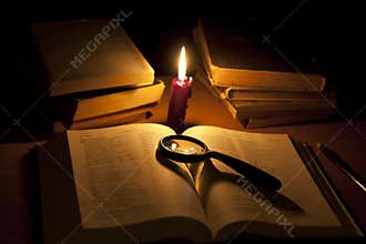 Bible and magnifier searching of god