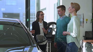 Saint Petersburg, Russia, March 06, 2021Sales manager car, agent consult couple about new automobile purchase choice