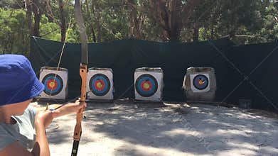 Young Australian girl archer aiming to target