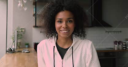 Happy young african american woman holding video call conversation.