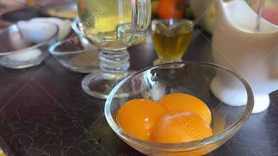 Beaten Egg Yolks in Bowl, Fresh Chicken Eggs for Cooking Recipe, Mixed Organic Yolks in glass Bowl