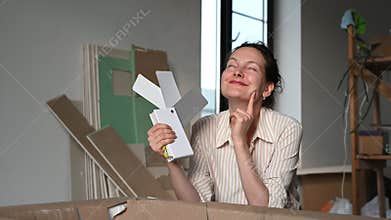 Home renovation: woman selecting paint colors for a fresh new look