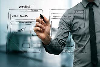 Designer drawing website development wireframe