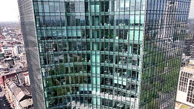 Panoramic shooting facade skyscraper. Flight through Frankfurt am Main, Germany. Skyline. New Skyscrapers, Urban Canyon