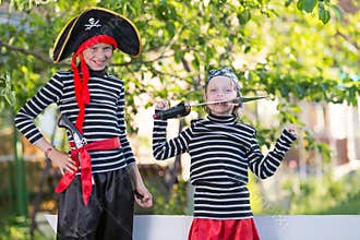 children play pirates at backyard