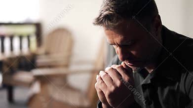 Man with praying hands. Male religious christian folded palms together asking god for help. Adult guy clasped arms