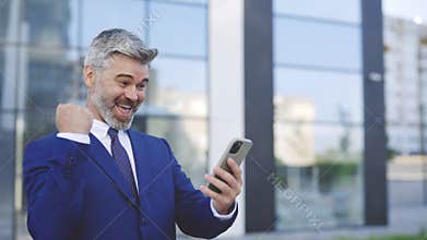 Caucasian Smiling Surprised Guy Emotionally Enjoys Success Good News, Businessman Boss Win Mobile Online Bet Bid Money