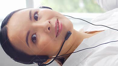 Diverse team of young professionals is working in the phone support office. Working day of sales managers in the call