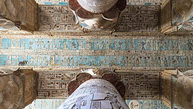 Ancient Egyptian hieroglyphs and bas-reliefs close-up in Dendera temple or Temple of Hathor. Egypt. Dendera Temple