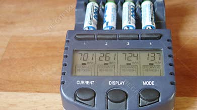 Close-up of batteries are charged in a special