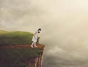 Woman walking on cliff.