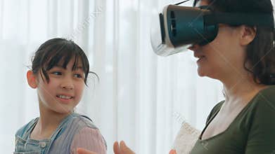 Granddaughter guide grandmother to dive in metaverse with VR. Divergence.