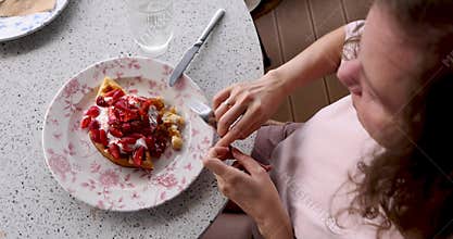 Delicious Strawberry Dessert Enjoyed at a Cozy Caf Table