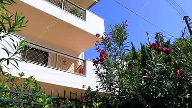 Walking at balcony and flowers in Voula Greece