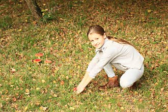 Girl with mushrooms Amanita muscaria