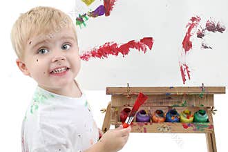 Addorable Toddler Boy Painting At Easel