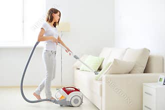 Attractive girl with vacuum cleaner