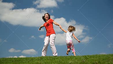 mother and daughter turning tohether holding hands