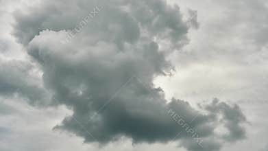 Timelapse gray clouds close-up. Rainy clouds gather before the rain. Climate change, global warming.