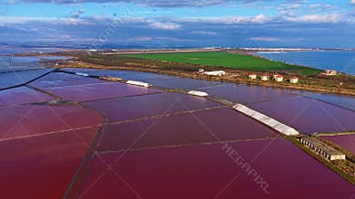 Vibrant colors blend in the salt pans of Salinas, showcasing nature's artistry in a serene
