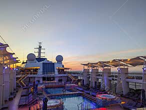 At sea 2025.09.13. - Empty pool deck during sunset on board a cruise ship