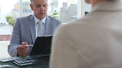 Businessman interviewing a woman