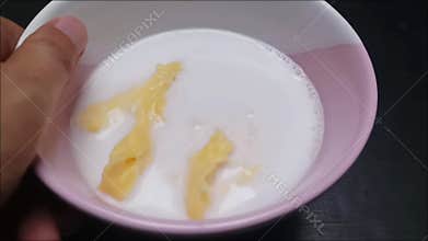 Footage of sweet fermented cassava dessert with coconut milk