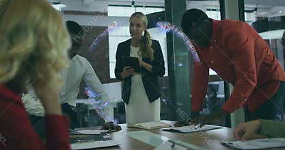 Business team watching holographic globe forming rotating and presenter updating data for analysis