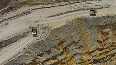 Aerial of open mine and heavy mining equipment