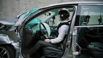 Stunt driver performing car crash test safety experiment
