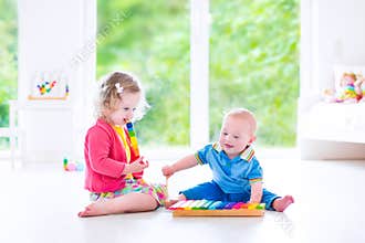 Kids playing music with xylophone