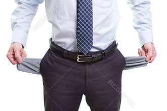 Broke and poor business man with empty pockets