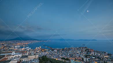 Naples, Italy. Top View Skyline Cityscape In Evening Lighting. Tyrrhenian Sea And Landscape With Volcano Mount Vesuvius