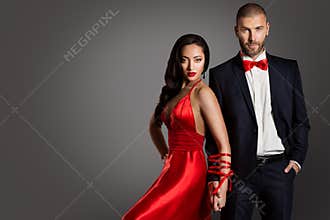 Fashion Couple, Woman and Man Arms Bounded by Ribbon, Red Dress Black Suit