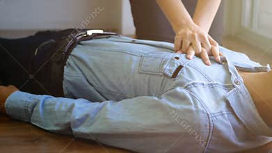 4K.volunteer office woman use hand pump on chest for first aid emergency CPR on heart attack man unconscious, try to resuscitation