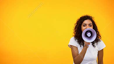 Afro-American female shouting in megaphone, public relations, social opinion