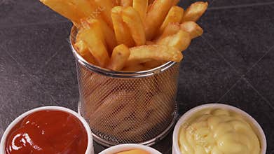 Delicious french fries served with sauce variety