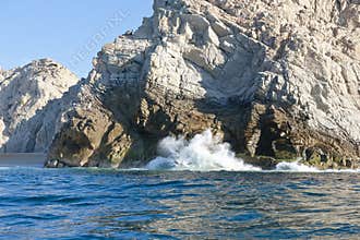 Waves breaking on rocks