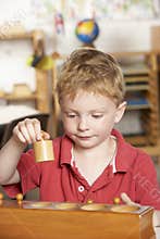 Young Boy Playing at Montessori/Pre-School