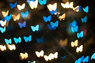 Bokeh background with unique butterfly shaped lights or blurred lights background