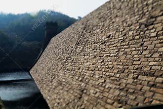Derwent Dam reservoir wall on a cloudy day