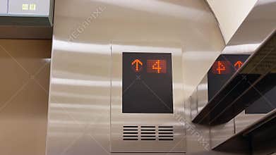 Motion of people taking elevator from three to seven floor