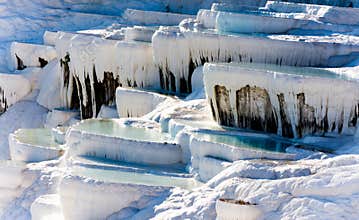 The natural white stone swimming pools fill with the thermal water
